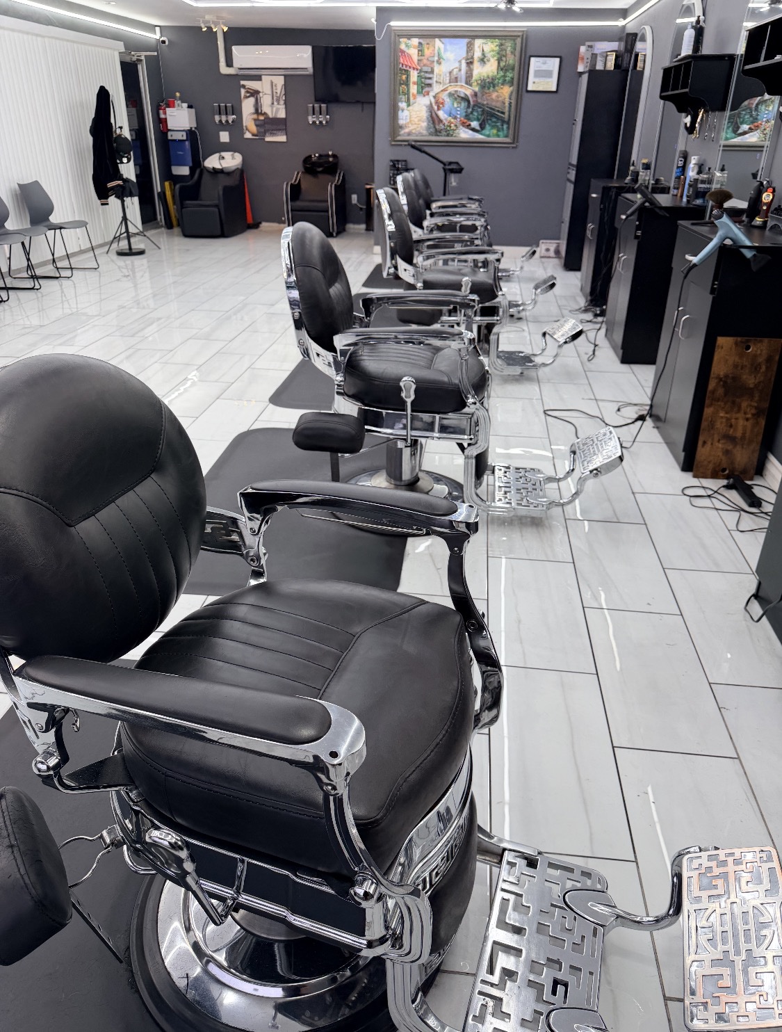 Row of barber chairs inside Omar's Barbershop
