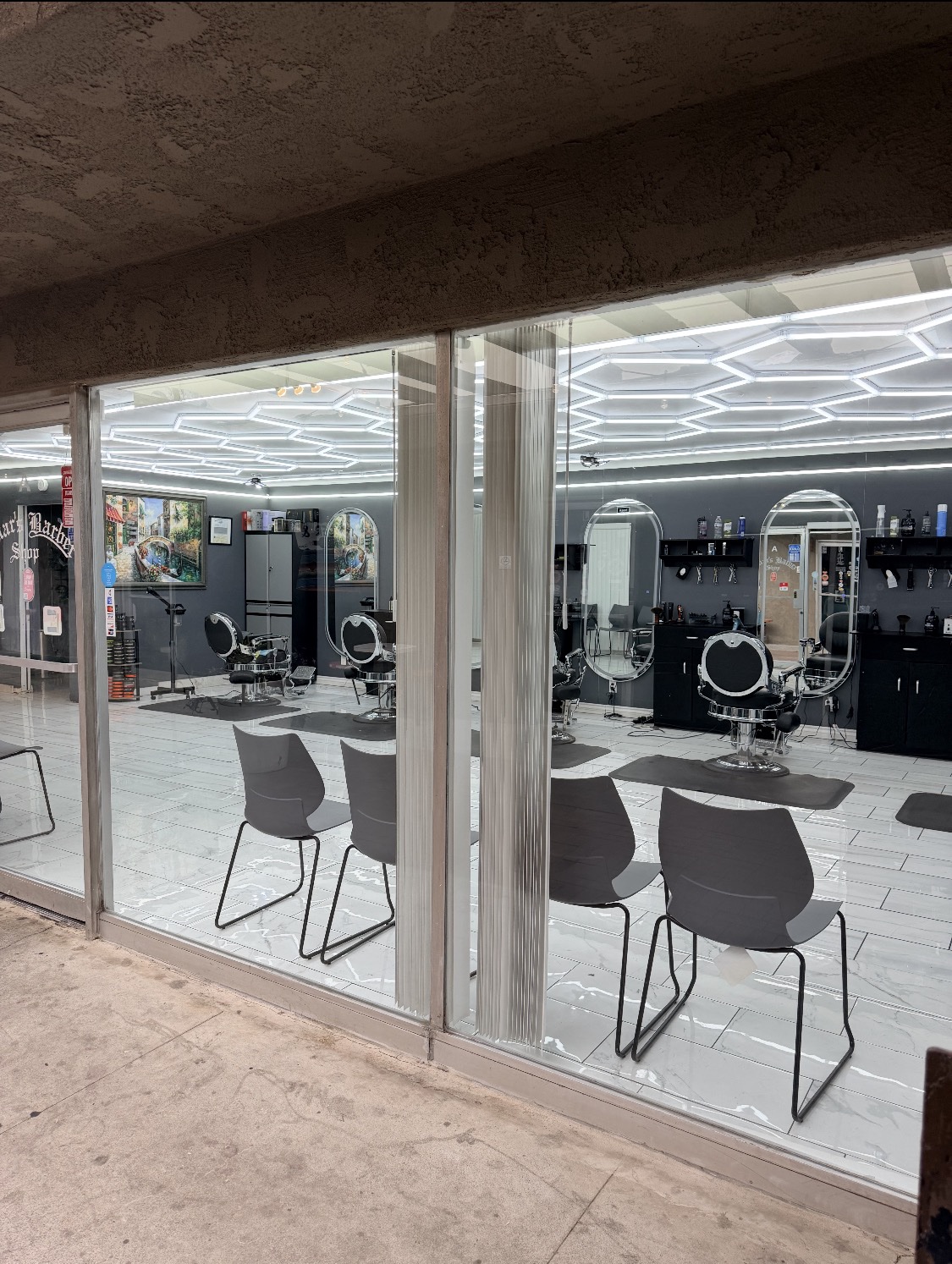 Inside Omar's Barbershop, view through the glass front