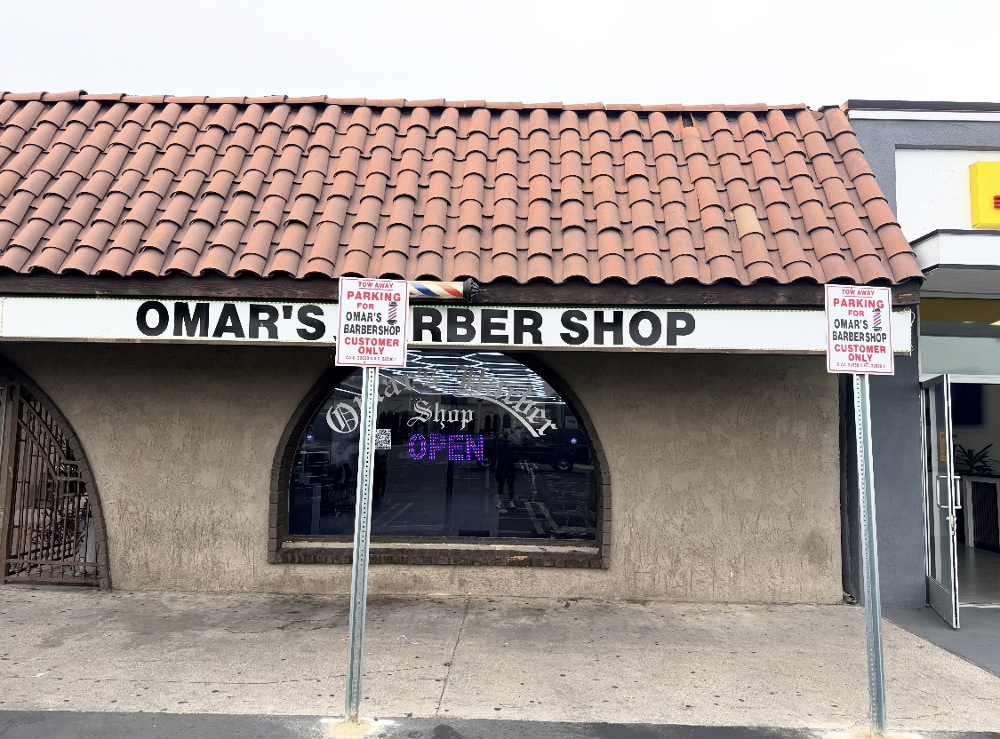 Omar's Barbershop storefront on Brookhurst St in daylight